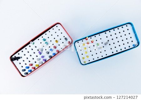 Colorful and Organized Collection of Fine-Tip Markers Showcased in Unique Red and Blue Storage Cases Arranged with Care and Neatness on a Plain White Background Colorful and Organized Collection of Fine-Tip Markers Showcased in Unique Red and Blue Storage Cases Arranged with Care and Neatness on a Plain White Background 127214027