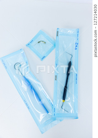 Selection of Dental Instruments in Sealed Sterile Packaging for Oral Hygiene and Dental Care Procedures in a Clinical Setting, Ready for Use by Professionals Selection of Dental Instruments in Sealed Sterile Packaging for Oral Hygiene and Dental Care Procedures in a Clinical Setting, Ready for Use by Professionals 127214030