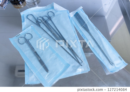 Set of Surgical Instruments Arranged on Sterile Wrapping in a Medical Environment for Surgical Procedures and Operations in Hospitals and Clinics Set of Surgical Instruments Arranged on Sterile Wrapping in a Medical Environment for Surgical Procedures and Operations in Hospitals and Clinics 127214084