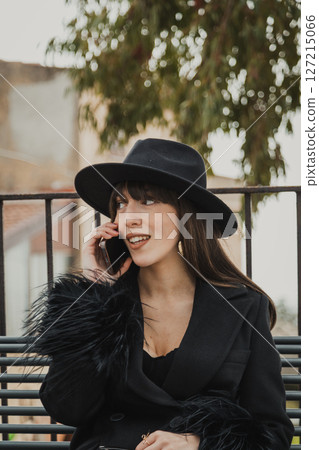 Elegant Woman On The Town Bench Having A Fun Call Close Up Elegant Woman On The Town Bench Having A Fun Call Close Up 127215066