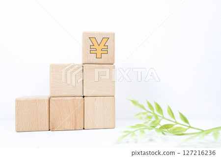 Stacked building blocks and Japanese yen symbol Stacked building blocks and Japanese yen symbol 127216236