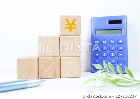 Stacked building blocks and Japanese yen symbol Stacked building blocks and Japanese yen symbol 127216237
