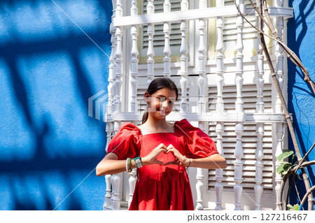 Sweet teenager girl in Cartagena de Indias. Travel concept. Sitting alone. Happy girl. 127216467
