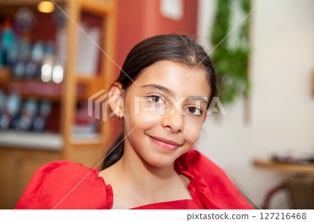 Sweet teenager girl in Cartagena de Indias. Travel concept. Sitting alone. Happy girl. 127216468
