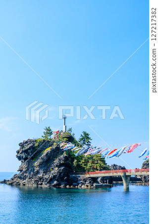 Noe Port Lighthouse and carp streamers in early summer, Itoigawa City, Niigata Prefecture 127217382