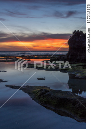 Sunset on the coast of a southern island Sunset on the coast of a southern island 127218176