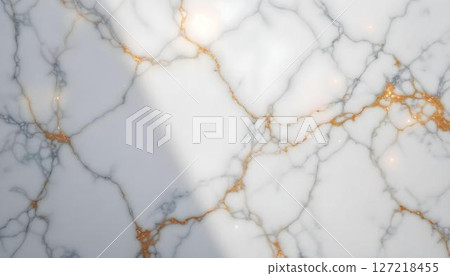 Close-up of a marble surface with striking gold and white paint, illustrating a blend of elegance and artistic flair 127218455
