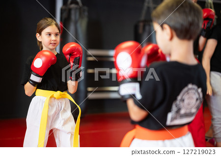 Children in gloves at boxing training Children in gloves at boxing training 127219023