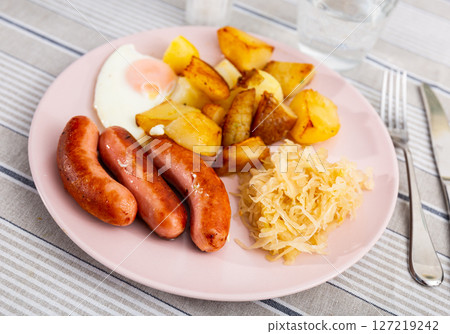Sausages with potatoes and eggs Sausages with potatoes and eggs 127219242