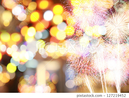 Vibrant Fireworks Display Against a Background of Blurred Colorful Bokeh Lights Creating a Festive Atmosphere for Celebrations and Special Events Vibrant Fireworks Display Against a Background of Blurred Colorful Bokeh Lights Creating a Festive Atmosphere for Celebrations and Special Events 127219452