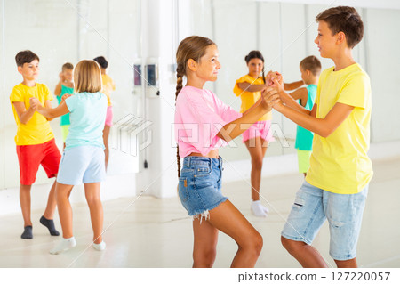 Group of kids dancing salsa in studio 127220057