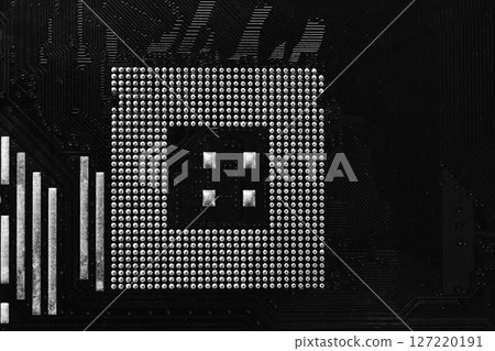 Old black motherboard of computer equipment focusing on CPU slot background, Technology background. Old black motherboard of computer equipment focusing on CPU slot background, Technology background. 127220191