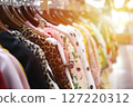 Colorful Dresses Hanging in a Retail Store Display 127220312