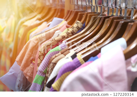 Colorful Dresses Hanging in a Retail Store Display Colorful Dresses Hanging in a Retail Store Display 127220314