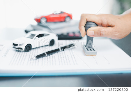 Businesswoman hand stamp approve on financial business approval document paper. Man hand accept permit contract agreement. Broker manager sign contract bank guarantee approved stamp application form Businesswoman hand stamp approve on financial business approval document paper. Man hand accept permit contract agreement. Broker manager sign contract bank guarantee approved stamp application form 127220800