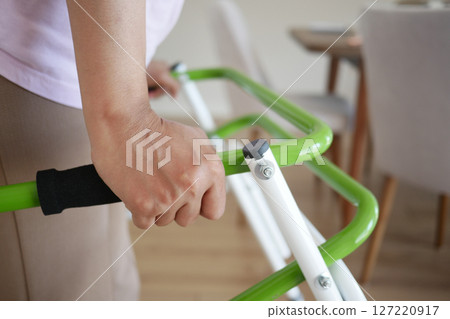 A Person Using a Modern Walker in a Bright and Welcoming Living Space for Increased Mobility A Person Using a Modern Walker in a Bright and Welcoming Living Space for Increased Mobility 127220917
