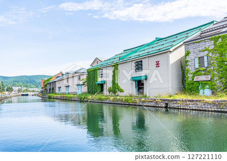 Otaru City, Hokkaido - One of Hokkaido's most popular tourist destinations - Otaru Canal and warehouses in early summer 127221110