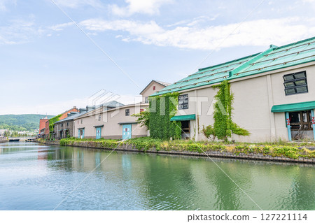 Otaru City, Hokkaido - One of Hokkaido's most popular tourist destinations - Otaru Canal and warehouses in early summer 127221114