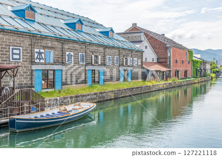 Otaru City, Hokkaido - One of Hokkaido's most popular tourist destinations - Otaru Canal and warehouses in early summer Otaru City, Hokkaido - One of Hokkaido's most popular tourist destinations - Otaru Canal and warehouses in early summer 127221118