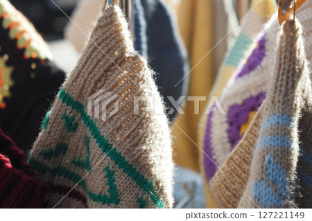 Bright and Colorful HandKnit Bags Beautifully Hanging in the Sunlight Bright and Colorful HandKnit Bags Beautifully Hanging in the Sunlight 127221149