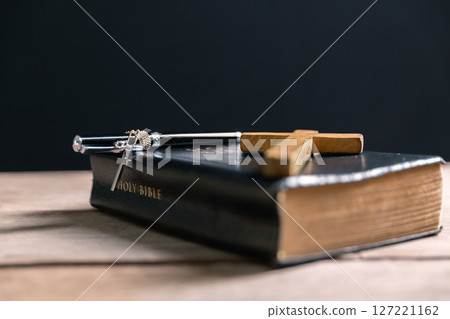 Religious belief concept Close up prayer Christian church service Bible Holy cross Spiritual power Blurred background Desk copy space Heaven God Catholic faith Praise book Jesus worship Gospel symbols Religious belief concept Close up prayer Christian church service Bible Holy cross Spiritual power Blurred background Desk copy space Heaven God Catholic faith Praise book Jesus worship Gospel symbols 127221162