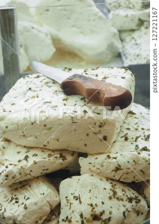 Delicious Fresh Herbal Cheese Served with a Classic Wooden Knife Delicious Fresh Herbal Cheese Served with a Classic Wooden Knife 127221167