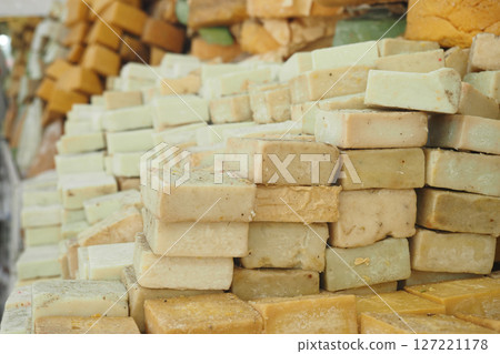 An Array of Colorful Soap Bars Beautifully Stacked at a Market Stall An Array of Colorful Soap Bars Beautifully Stacked at a Market Stall 127221178