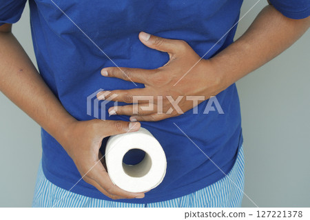 Discomfort and Relief: Holding Toilet Paper for Stomach Issues Discomfort and Relief: Holding Toilet Paper for Stomach Issues 127221378