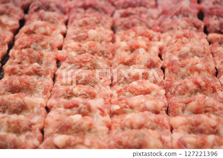 Beautifully Displayed Freshly Prepared Raw Ground Meat Blocks for Sale 127221396