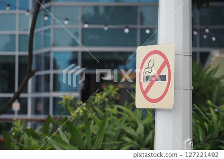 No smoking sign displayed in front of modern building No smoking sign displayed in front of modern building 127221492