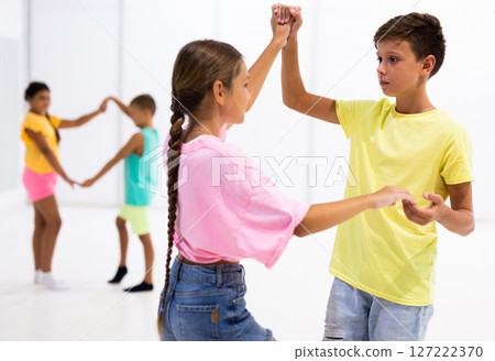 Group of kids dancing salsa in studio 127222370