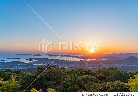 (Nagasaki Prefecture) Evening view of Sasebo and Kujukushima Islands from the Yumiharidake Observatory 127222583