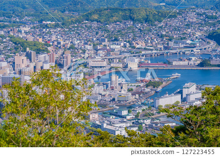 (Nagasaki Prefecture) Evening view of downtown Sasebo and the harbor from the Yumiharidake Observatory 127223455