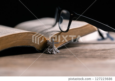 Religious belief concept Close up prayer Christian church service Bible Holy cross Spiritual power Blurred background Desk copy space Heaven God Catholic faith Praise book Jesus worship Gospel symbols Religious belief concept Close up prayer Christian church service Bible Holy cross Spiritual power Blurred background Desk copy space Heaven God Catholic faith Praise book Jesus worship Gospel symbols 127223686