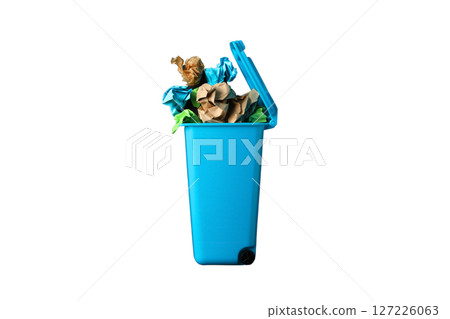 Blue bin filled with colorful paper waste, isolated on white Blue bin filled with colorful paper waste, isolated on white 127226063