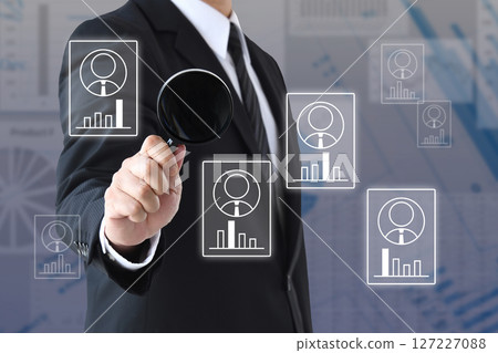 Image of analyzing various human resource characteristics with a magnifying glass Image of analyzing various human resource characteristics with a magnifying glass 127227088