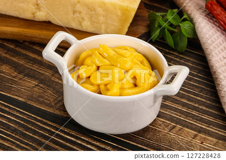Yellow cheese sauce in the bowl Yellow cheese sauce in the bowl 127228428