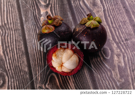 Ripe sweet juicy tropical mangosteen Ripe sweet juicy tropical mangosteen 127228722