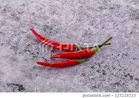 Hot spicy red chili peppers 127228723
