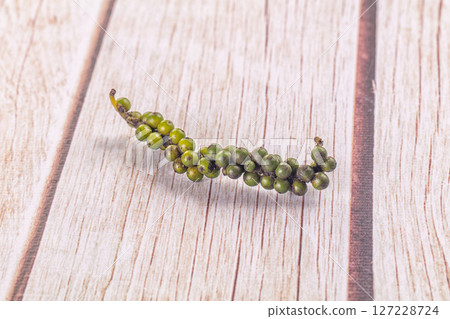 Ripe green pepper corn branch 127228724