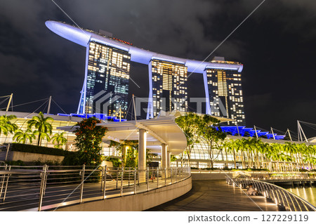 Night view of the Marina Bay Sands. This integrated resort fronts Marina Bay in Singapore. At night, there is an exhilarating music, light, and water dance show. Night view of the Marina Bay Sands. This integrated resort fronts Marina Bay in Singapore. At night, there is an exhilarating music, light, and water dance show. 127229119