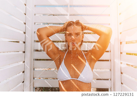 Woman Beach Shower Sunlit Bikini: Summer Beach Showering, White Cabana, Sunlight. 127229131