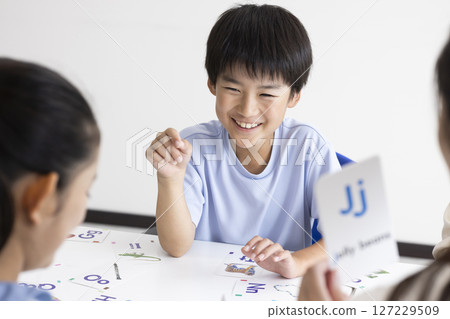 Children taking English classes Children taking English classes 127229509