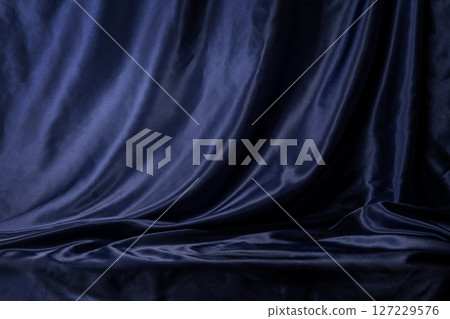A space with draped silk blue fabric A space with draped silk blue fabric 127229576
