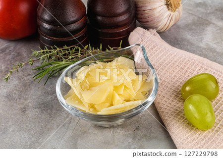 Parmesan cheese slices in the bowl 127229798