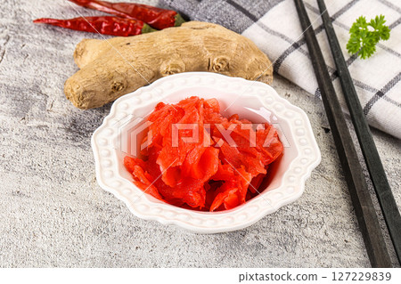 Marinated ginger root in the bowl 127229839