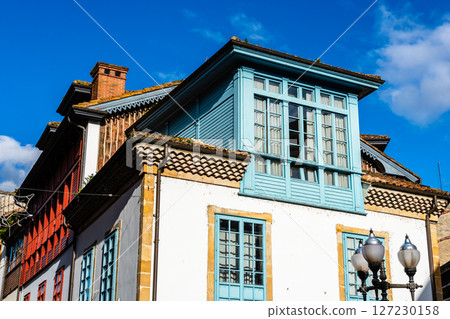 Sunlit Bay Window on White Building. Villaviciosa 127230158