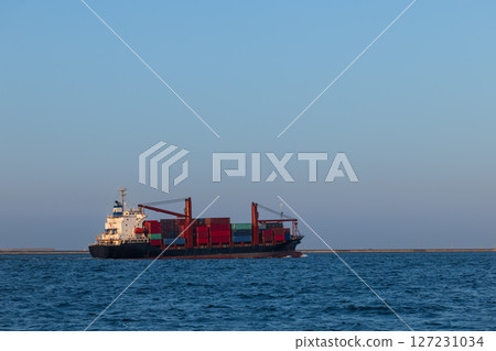 Container ship leaving the port 127231034