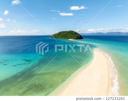 Ocean waves crashing over Bon Bon Sandbank. Beautiful scenery of turquoise sea water. Romblon Island. Romblon, Philippines. 127231261