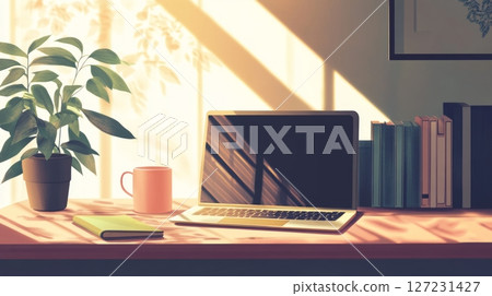 Laptop computer on a desk next to a green plant in a modern workspace environment 127231427